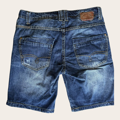 Damskie szorty jeansowe TrickandChic w stylu vintage y2k z przetarciami i naszywką Sicko 19 Denim na tylnej kieszeni